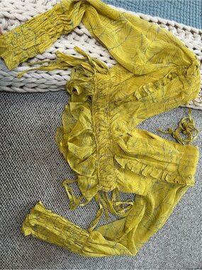 Smocked Yellow Printed Ruffle Jumpsuit with Tie Details